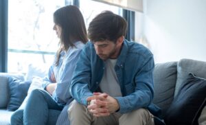 Man and woman thinking about what is codependency addiction.