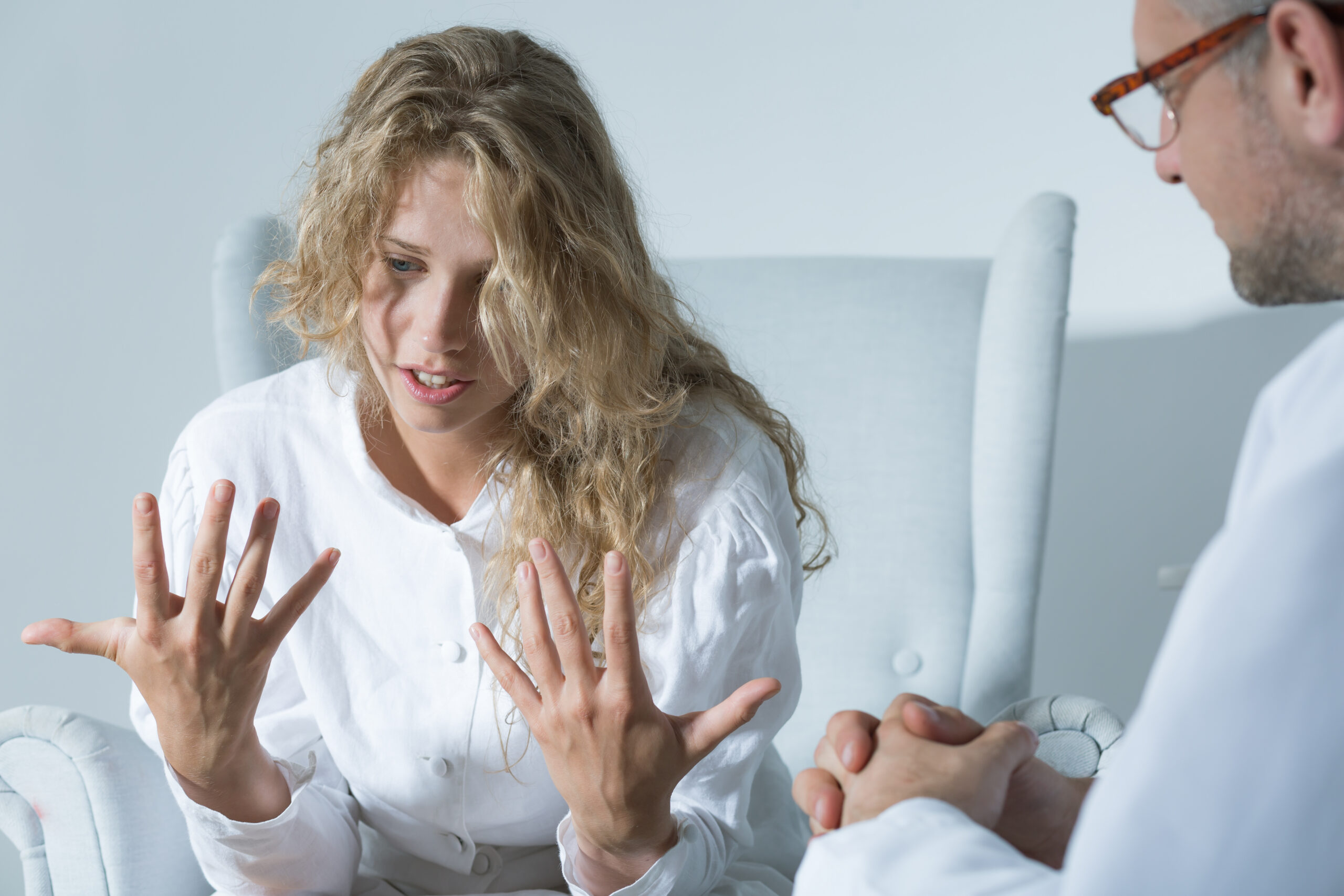 Woman talking to her psychiatrist about what are the best MAT Drugs For Opioid Addiction treatment.