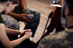 Group of veterans talking in a support group after Looking For Outpatient Rehab For Veterans in Los Angeles.
